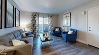 Located in Phoenix, AZ, this well-appointed one-bedroom, one-bathroom unit offers a thoughtfully designed layout that maximizes every square foot. The open-concept kitchen and living area serves as the heart of the home, featuring wood-look plank flooring that flows throughout. The kitchen is outfitted with dark espresso cabinetry, white countertops, and a full suite of stainless steel appliances, including a refrigerator, dishwasher, range, and over-the-range microwave. Ample upper and lower cabinet storage adds practicality to the sleek design. The living room is bright and welcoming, with sliding glass doors that open to a private balcony, allowing natural light to fill the space. The bedroom is carpeted for comfort and features a large window, providing additional natural light and a cozy ambiance. A dedicated closet offers convenient storage. The bathroom includes a combined tub and shower unit with clean white finishes and wood-look flooring. An in-unit laundry area rounds out the functional amenities of this efficient and modern living space.