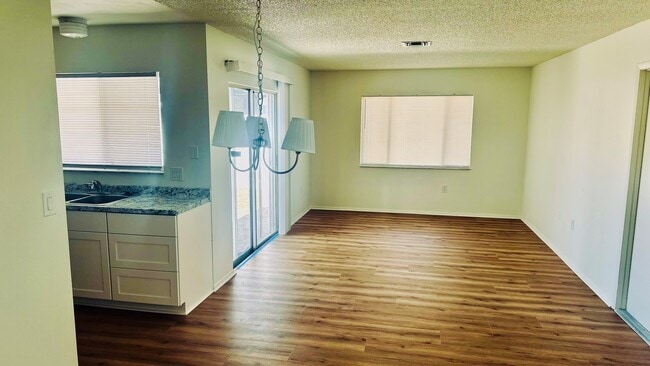 Combined dining/family room adjacent to kitchen - 6932 124th Ave