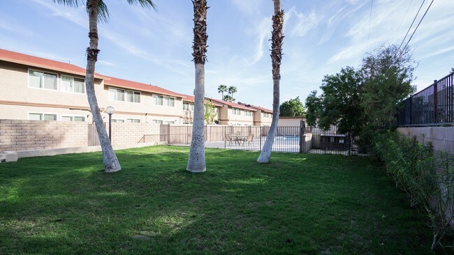 Newly seeded lawn area. - Victoria Townhomes