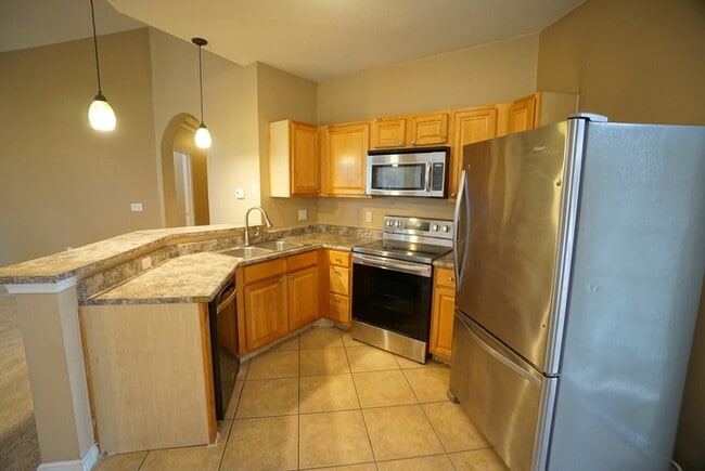 Building Photo - 2-Bed, 2-Bath, Condo with Garage in The Villas Condominiums