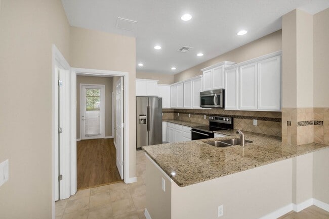 Building Photo - Beautiful 3/3/2 in Gated Amenity Rich Vill...