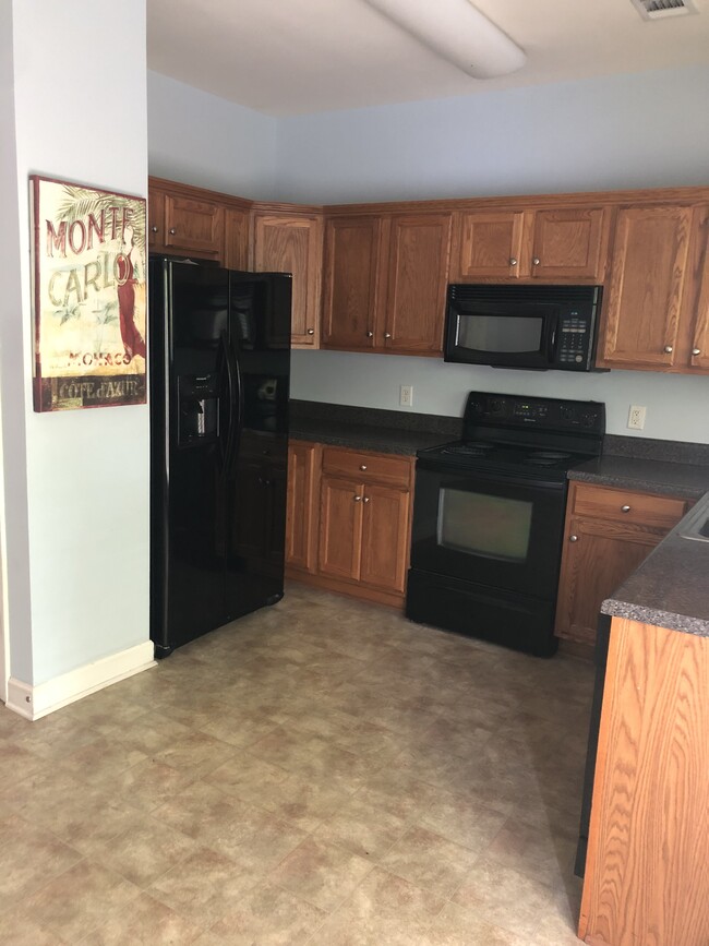 Kitchen connects to main living space - 3535 Bell Rd