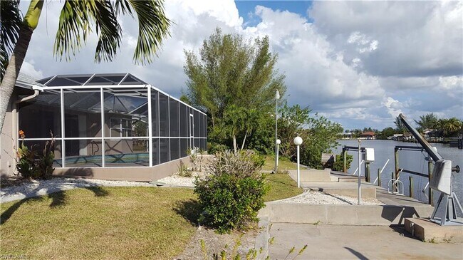 Building Photo - Gulf access Pet Friendly Pool home in SW C...