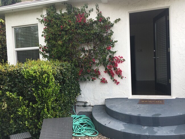 Front door through private walled garden - 518 N San Vicente Blvd