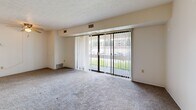 Located at 1200 Vineyard Dr, Unit 404 in Broadview Heights, Ohio, this one-bedroom, one-bathroom apartment offers a well-organized layout across a single floor. The living room is a comfortable, carpeted space highlighted by a full-width sliding glass door that opens to a balcony, flooding the room with natural light and providing views of the surrounding greenery and community grounds. Vertical blinds offer privacy and light control throughout.

The kitchen has been thoughtfully updated with crisp white shaker-style cabinetry, dark countertops, wood-look flooring, and a stainless steel range, creating a functional and modern cooking space with ample storage.

The bedroom is a generously sized, carpeted retreat featuring a large window with balcony access, offering natural light and outdoor views. A dedicated closet provides convenient storage.

The bathroom is finished with warm hardwood-style flooring, a white vanity with cabinet storage, and a tub-shower combo adorned with marble-style tile surround, lending a clean and polished aesthetic.

The unit also includes dedicated closet space and is situated within a multi-building community with ample parking. The property's lush landscaping and green surroundings contribute to a pleasant residential atmosphere in this established Broadview Heights neighborhood.