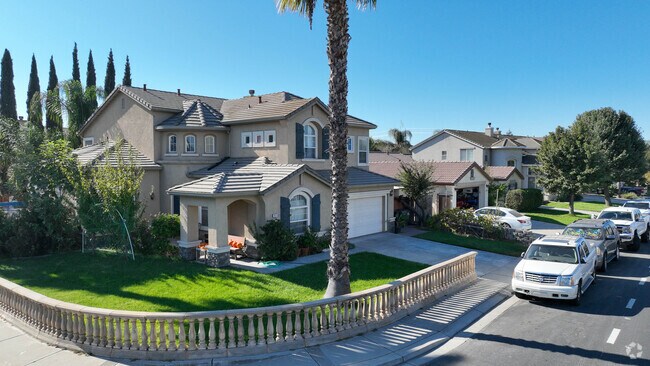 There are plenty of beautiful houses and trees in the West Manteca neighborhood.