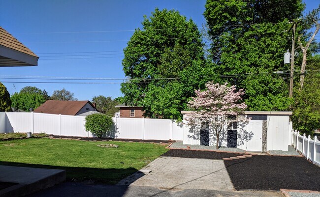 Large backyard with brick parking spot and shed. Shed is insulated,drywalled. - 4250 10th Ave