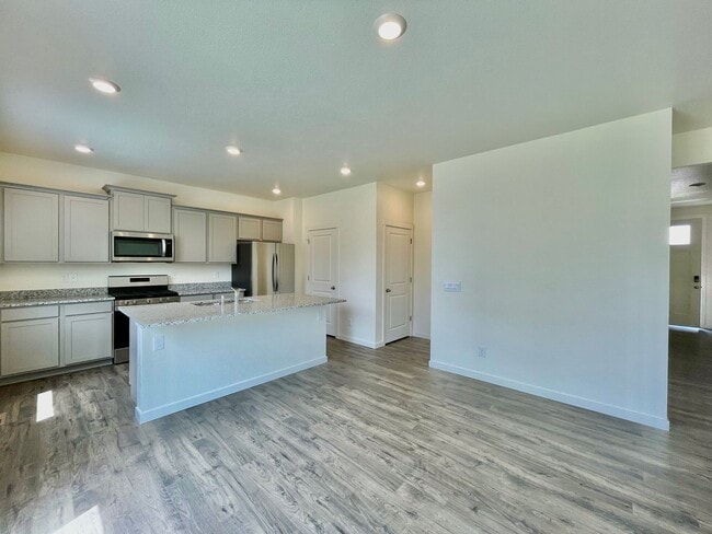 Building Photo - Spacious 4-Bedroom Wellington Home with 3-Car Garage, Loft & Fenced Backyard!