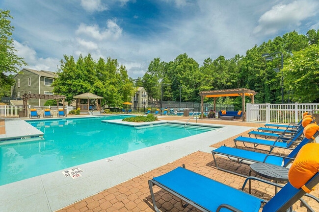 Enjoy sunny afternoons by our sparkling resort-style pool at Avenues of Kennesaw. - Avenues of Kennesaw