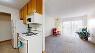 This single-floor unit offers a functional and well-organized layout across several distinct spaces. The galley-style kitchen is efficiently designed with warm oak cabinetry lining both walls, providing ample storage. White appliances include a gas range with an over-the-range microwave, dishwasher, and refrigerator, complemented by light tile flooring and a single-basin sink. Adjacent to the kitchen is a dedicated dining area featuring the same tile flooring, a chandelier overhead, and direct access to additional counter space, making it practical for everyday meals.

The living area is carpeted and bright, benefiting from a sliding glass door that introduces natural light and provides access to an outdoor space. The open feel of the room is enhanced by neutral walls and textured ceilings consistent throughout the unit.

Both bedrooms are carpeted and feature windows that bring in natural light, with clean, neutral walls offering a calm atmosphere. A flexible additional room, also carpeted and windowed, can serve as a home office or secondary bedroom, and features exposed ductwork adding an industrial touch.

The bathroom is neatly finished with small mosaic tile flooring, a tiled tub and shower surround accented by a decorative glass tile border, a wood-framed vanity, and built-in shelving, completing this well-rounded space.
