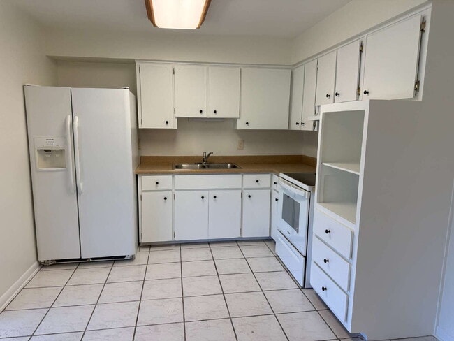 Photo - "Charming 2-Bedroom Retreat with optional studio on Coral Avenue – Cozy Comfort Awaits in Kissimm... Apartment