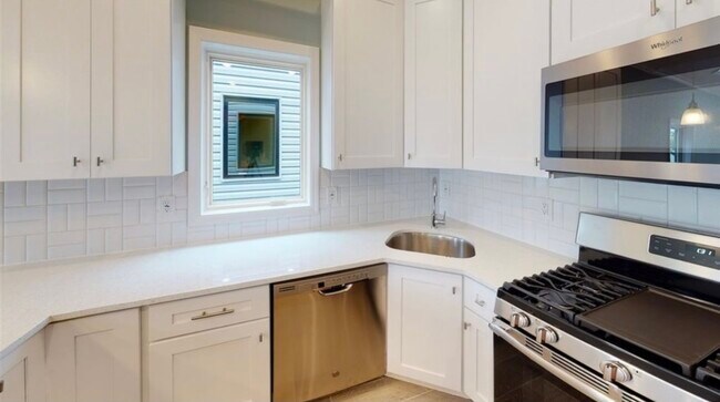 Kitchen with gas range stove, microwave, dishwasher, and fridge (not pictured) - 366 Armstrong Ave