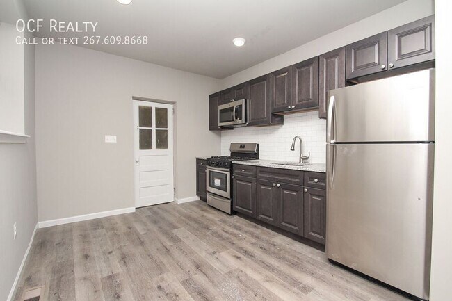 Building Photo - Three Bed Kingsessing Townhome