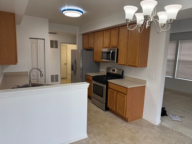 Building Photo - Partially Furnished - Bright & Spacious 2BR/1.5 BA CONDO - End-Unit w/ 2-Car Garage, Appliances, ...