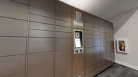 Located at 285 Park Ave in Savannah, Georgia, this single-floor space houses a dedicated Package Concierge system designed to streamline the secure receipt and retrieval of deliveries. The installation features a expansive wall of uniform, bronze-toned lockers that span floor to ceiling and extend across a wide section of the interior wall, offering an impressive number of compartments in varying sizes to accommodate packages of different dimensions.

At the center of the locker bank is an integrated digital kiosk, complete with a touchscreen interface, a scanner, and branding consistent with the Package Concierge system. This hub serves as the control point for accessing parcels, allowing users to retrieve their deliveries through an automated, self-service process at any time.

The locker panels carry a warm, taupe-brown finish that gives the installation a clean, modern aesthetic, blending functionality with a polished appearance. The overall design reflects a commitment to convenience and security, making package management straightforward and efficient for all users of the building.