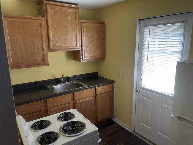 Full kitchen with refrigerator - 1387 N Cole St
