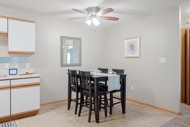 Enjoy meals and good conversations in the dining space off your kitchen - Williamsburg Park Apartments