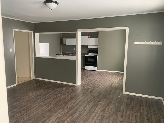 Living room looking towards kitchen - 7504 NY-177