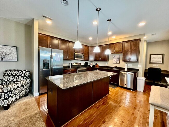 Building Photo - Executive corporate rental features community pool. Fully furnished and includes all utilities.