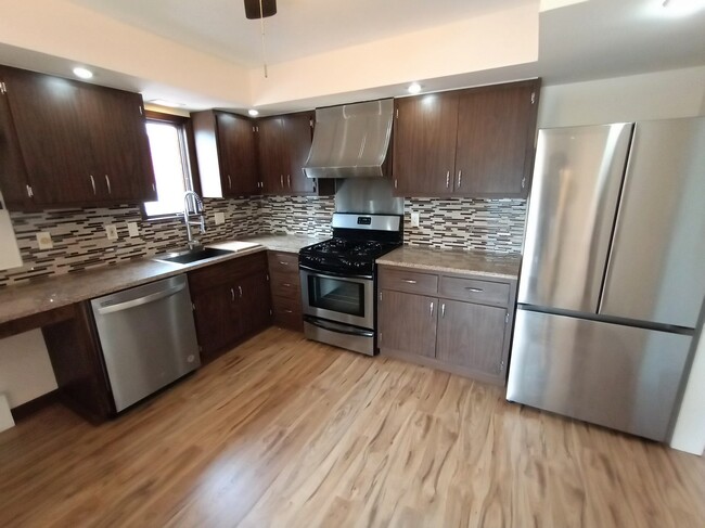 Kitchen w stainless steel appliances - 18 W Union Ave