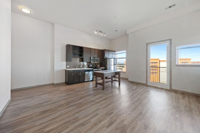 Large spacious living room with luxury vinyl plank flooring - The Casey