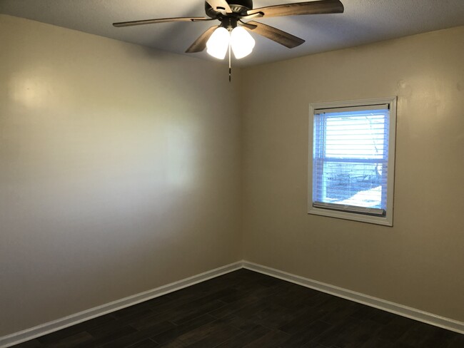 Bedroom 1 & 2 have all new porcelain tile floors, planation blinds, adjustable shelving, fans - 357 E Main St