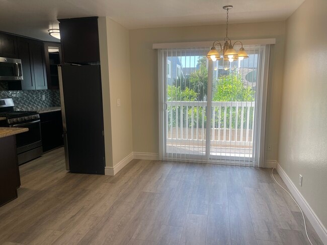 Vinyl slider that opens to a private balcony. - 2411 Prospect Ave
