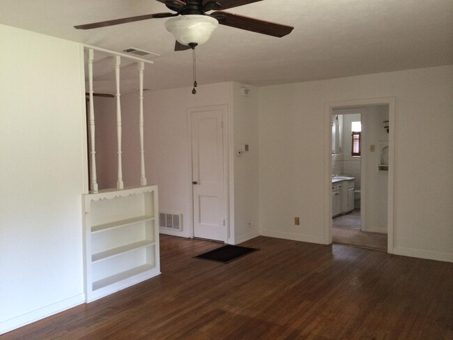 Open living area with pine floors - 718 Cordell St