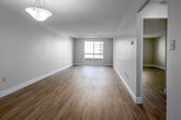 Located at 433 King St in downtown London, Ontario, this one-bedroom, one-bathroom unit offers a well-organized and functional layout across a single floor. Light-toned hardwood-style flooring runs throughout the space, lending a clean and cohesive aesthetic from room to room.

The entrance leads into a hallway that connects the key areas of the unit. The kitchen is efficiently designed with white shaker-style cabinetry, dark granite-look countertops, and a full suite of stainless steel appliances including a refrigerator, electric range, microwave, and dishwasher. A dedicated dining or prep area with additional cabinetry provides practical storage.

The living room is generously proportioned and filled with natural light from a large sliding window that frames views of the surrounding urban cityscape. A pendant light fixture adds a touch of character to the open space.

The bedroom is a comfortable, well-sized room featuring a window with an exterior city view and a full sliding-door closet with built-in wire shelving for organized storage. Neutral grey walls and light flooring keep the room bright and versatile.

The bathroom includes a full soaker tub with tiled surround, a toilet, and a vanity with a granite-look countertop and under-sink storage. Clean white finishes throughout give the bathroom a fresh, functional feel.