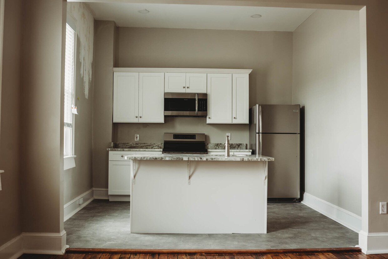 Open concept kitchen and living area - 529 Washington E St