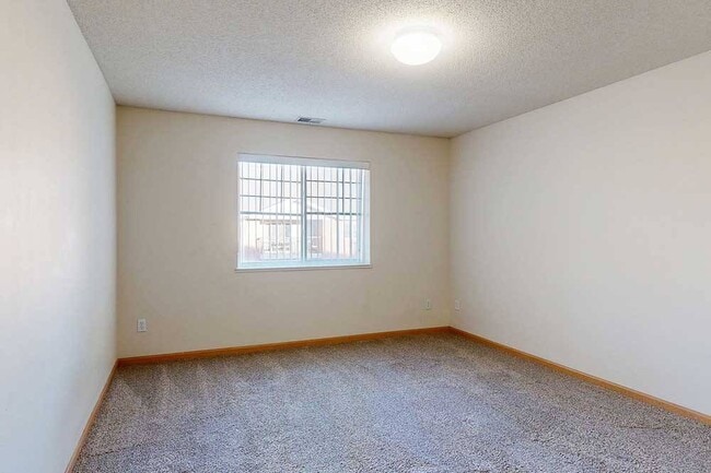 Wake up to natural light pouring inyour bedroom is a peaceful, private retreat with plenty of space to unwind. - Northbrook Apartments
