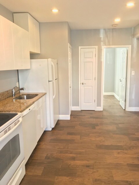 Kitchen, W/D, and closet with open door leading to bedroom - 708 Q St NW