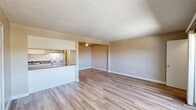 Located at 1961 Howe Ave in the Arden-Arcade neighborhood of Sacramento, CA, this 2-bedroom, 1-bathroom unit offers a functional and well-organized single-floor layout. The open living area welcomes you with light wood-look laminate flooring, neutral beige walls, and a textured ceiling, creating a clean and airy atmosphere. A pass-through counter connects the living space to the kitchen, which is equipped with white cabinetry, a coil electric range, a refrigerator, a dishwasher, and a double-basin sink with dark granite-style countertops — all finished with coordinating wood-look flooring. The living room also features a sliding glass door that opens to an outdoor area, allowing natural light to fill the space. Both bedrooms are carpeted and offer a calm, neutral palette, with windows that bring in natural light and views of surrounding greenery. The primary bedroom provides a comfortable amount of space. The full bathroom includes a vanity with a granite-style countertop, a mirrored medicine cabinet, and wood-look flooring. Two closets provide ample storage throughout the unit. The overall layout is practical and efficient, making thoughtful use of every square foot.