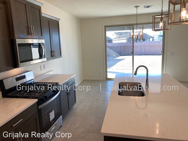 Building Photo - 4 br, 3 bath House - 10677 W Harrigan Drive