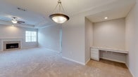 Located at 280 New Haven Blvd in Montgomery, Alabama, this single-floor residence offers a well-designed layout with comfortable living spaces throughout. The spacious living room serves as the heart of the home, featuring a tray ceiling with a ceiling fan, a classic fireplace with a white surround, recessed lighting, and large windows that invite natural light. Plush carpeting flows through the living areas and bedrooms, contributing to a warm and inviting atmosphere.

The kitchen is outfitted with white cabinetry, marble-style countertops, a double-basin sink, a dishwasher, an electric range, and a built-in microwave. Track lighting and a pendant light add functional brightness, while wood-look flooring grounds the space. An adjacent area features a built-in desk with white cabinetry, providing a convenient workspace.

The bedrooms are generously sized, each finished with carpet, ceiling fans, and windows offering natural views. The bathrooms feature white vanity cabinetry, solid countertops, wood-look tile flooring, and clean, neutral finishes. A dedicated laundry room with full-size washer and dryer hookups adds everyday convenience. Crown molding and consistent neutral tones throughout create a cohesive, move-in-ready environment.