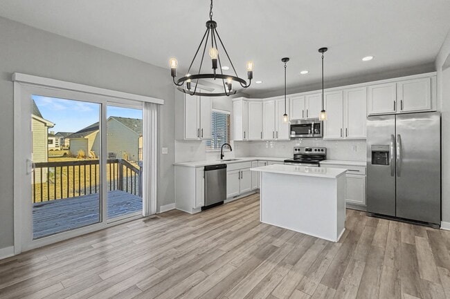 Building Photo - Spacious 4-Bedroom Home with 2-Car Garage & Yard