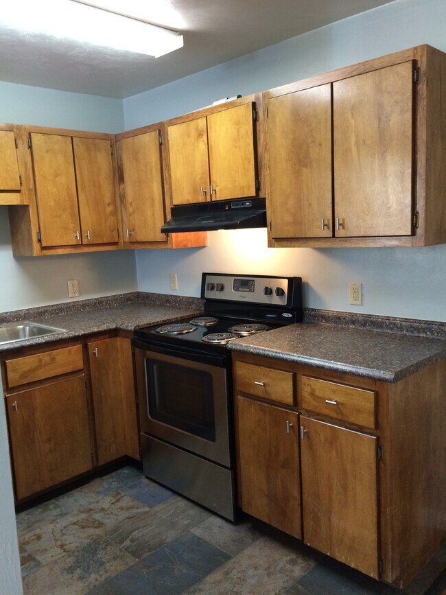 Kitchen with stainless steel appliances. - 815 W Brevard St