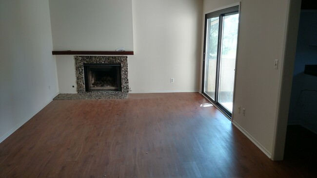 Living room (shown w. old fireplace) - 6716 Clybourn Ave