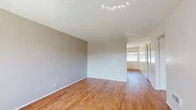 Located at 9091 Holder St in Cypress, CA, this single-story 1-bedroom, 1-bathroom unit offers a practical and comfortable layout across a well-utilized floor plan. Warm hardwood-style flooring runs throughout the main living areas, complemented by neutral gray walls and textured ceilings that lend a clean, cohesive aesthetic.

The open-concept living and dining area is bright and inviting, with a large window dressed in vertical blinds that allows natural light to fill the space. A ceiling fan with a light fixture anchors the dining area, which also features a built-in counter with a sink — a convenient functional detail. The living room flows seamlessly into the rest of the unit, offering a versatile and airy feel.

The kitchen is efficiently designed with white cabinetry, light countertops, a stainless steel sink, a dishwasher, and an electric range. A dedicated pantry closet provides generous additional storage. Recessed lighting keeps the kitchen well-lit.

The bedroom offers a comfortable retreat with plush carpeting, warm neutral tones, and a closet. The full bathroom includes a tub/shower combination, a vanity with storage, and hardwood-style flooring consistent with the rest of the unit.

A connecting hallway ties the layout together, making this a well-organized and functional home.
