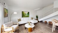 Located at 8960 SW 122nd Ave in Miami, FL, this two-story residence offers a thoughtfully designed layout spread across two floors. The main level hosts the open-concept living, dining, and kitchen areas, while the upper floor is home to the three bedrooms and two full bathrooms. The kitchen is well-appointed with rich cherry wood cabinetry, granite countertops, stainless steel appliances including an electric range, dishwasher, and refrigerator, and durable wood-look flooring. A convenient closet with louvered doors adds practical storage nearby. The living room is bright and welcoming, featuring large windows and a sliding glass door that opens to a balcony with lush outdoor views, filling the space with natural light. A staircase with a metal railing connects the two levels seamlessly. The generously sized primary bedroom features soft carpeting and a ceiling fan, while additional bedrooms offer comfortable layouts with closet access. Both bathrooms are finished with granite-topped vanities, framed mirrors, and tub-shower combinations with clean white tile surrounds. The dining area is intimate and well-lit, complemented by track lighting and a large mirror. Throughout the home, a clean, neutral palette creates a bright and cohesive ambiance.