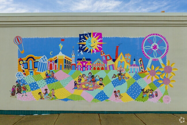 Public Art includes a mural of Mary Lou Stropoli's Mural "It’s a Small Town After All."