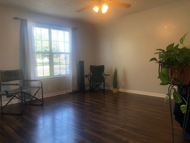 Spacious living room with hardwood flooring - 210 Golden Pond Ave