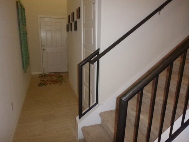 Half bathroom downstairs, 3 bedrooms, 2 full baths, loft area, stackable washer/dryer upstairs - 1001 Zodiac Ln