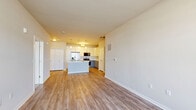 Located at 4301 Yates Dr in Mount Pleasant, WI, this well-designed one-bedroom, one-bathroom unit offers a smart and efficient single-floor layout. The open-concept living and kitchen area serves as the heart of the home, finished with light wood-look luxury vinyl plank flooring that adds warmth and continuity throughout. The kitchen is thoughtfully appointed with two-tone cabinetry — white upper cabinets paired with gray lower cabinets — stainless steel appliances including a refrigerator with ice maker, range, and over-the-range microwave, as well as a central island with a white countertop and undermount sink. Pendant lighting over the island adds a modern touch. The living area is bright and open, offering generous wall space and large windows that invite natural light and views of the surrounding neighborhood. The bedroom features plush carpeting, a sizable window with neighborhood views, and access to a dedicated walk-in closet with built-in shelving. Two additional closets provide ample storage throughout the unit. The bathroom is finished with gray cabinetry, a white countertop vanity, and wood-look flooring. A dedicated laundry area and utility room round out the practical features of this move-in-ready home.