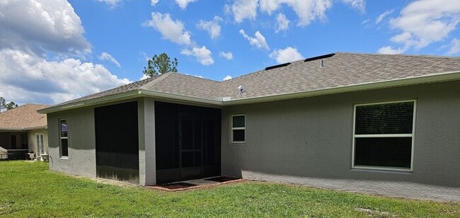 Building Photo - Beautiful 4/2 Home in Palm Coast Screened ...