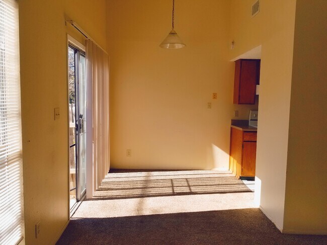 high ceiling dinner room with new carpet - 1007 Fieldwood Dr
