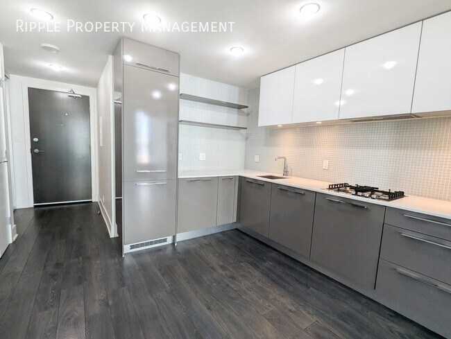 Photo du bâtiment - AMAZING 1 BED+DEN/ 1 BATH CONDO IN THE HEART OF DOWNTOWN | AC AVAILABLE