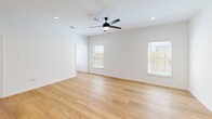 Located at 349 Ridge Rd in Lafayette, Louisiana, this well-appointed 3-bedroom, 2-bathroom single-story home offers a thoughtfully designed layout with a clean, modern aesthetic throughout. Warm-toned hardwood flooring flows consistently across every room, complementing the crisp white walls and creating a bright, cohesive atmosphere.

The kitchen serves as a standout feature, showcasing white shaker-style cabinetry with matte black hardware, granite countertops, a subway tile backsplash, and a full suite of stainless steel appliances including a gas range, microwave, dishwasher, and French door refrigerator. A center island provides additional prep and storage space, while a window above the sink fills the room with natural light.

The open living area is generously sized, featuring recessed lighting, a ceiling fan, and multiple windows that invite natural light from multiple directions. Each of the three bedrooms continues the hardwood flooring and includes a ceiling fan, window with blinds, and ample wall space. The primary bedroom offers a comfortable, private retreat.

Both bathrooms are finished cleanly, with one featuring a tub-shower combination and granite vanity countertop. A dedicated laundry room houses a full-size washer and dryer with overhead cabinetry for added storage. The layout also includes multiple hallways, closets, and efficient use of space throughout.