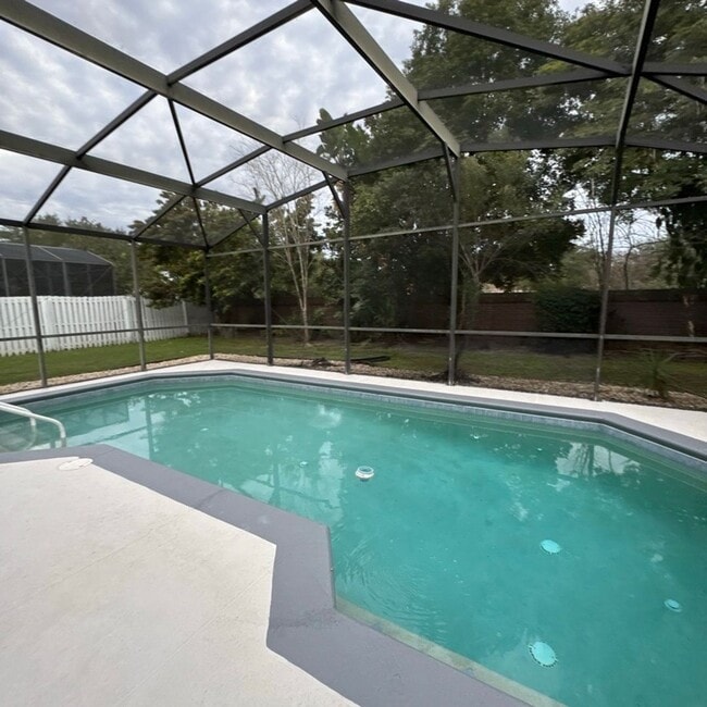 Building Photo - Modern Comfort Meets Orlando Living | Spacious 4-Bedroom Home with Large Yard! POOL HOME! GATED C...
