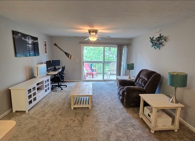 Living Room with Private Balcony - 240 Legends Creek Pl